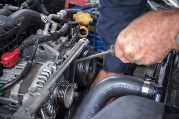 Fototapeta premium Close Up Photo Of Mechanic Repairing Car