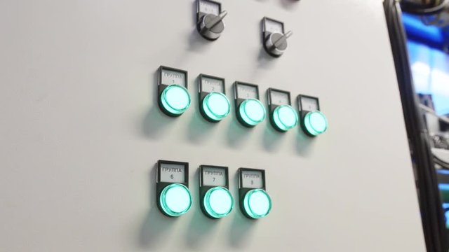 Metallic cabinet external door with white, red, green and yellow round shaped buttons and following titles: network, network crash, work, fan crash, filter