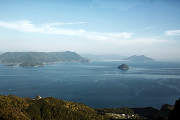 View over Miyajima and Hiroshima Bay from inside cabin of ropeway cable car.  Miyajima, Japan