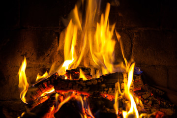 Wood burning in a cozy fireplace at home, keep warm