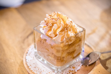 vanilla ice cream with chocolate lava  and Cereal on wooden table