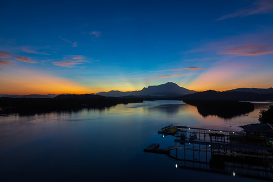 Amazing Beautiful Twilight Sunrise with Rays of light and Mount Kinabalu as background at Gayang, Tuaran, Sabah, Borneo