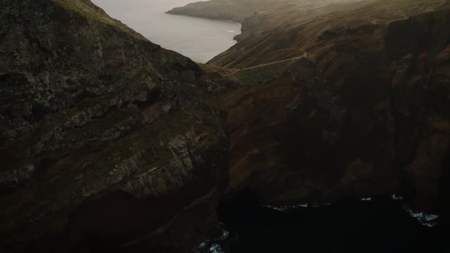 Epic aerial tilt up shot of Madeira's dramatic hiking trails on the east coast.