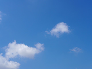 The vast blue sky with soft white clouds. Abstract white and blue background.