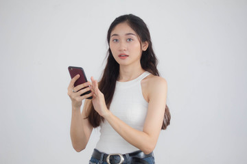 Portrait of thai china adult beautiful girl White shirt blue jeans using her smart phone