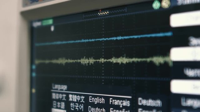 Close-up graph of the radio frequency line when calculating noise on the monitor screen. Scientific measurements, control tests of electrical equipment. The concept of analysis. Radio interference.