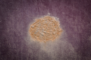 Rust spots on burgundy color car