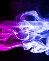 Fototapeta premium Colored smoke on black background