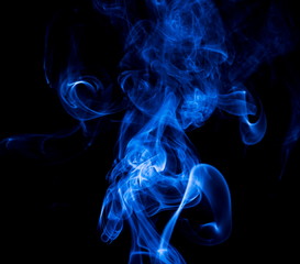 Fototapeta premium Blue smoke on black background