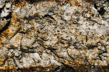 Stone texture background. The surface of granite and basalt. a large rock, a stone wall. close up....