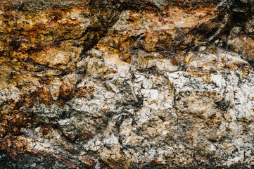 Stone texture background. The surface of granite and basalt. a large rock, a stone wall. close up. place for text.
