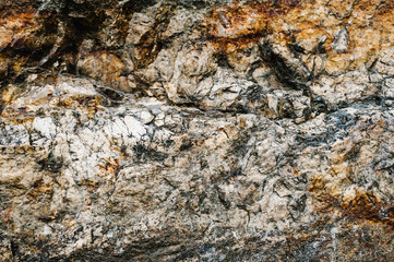 Stone texture background. The surface of granite and basalt. a large rock, a stone wall. close up. place for text.