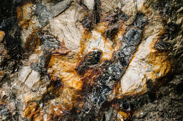 Stone texture background. The surface of granite and basalt. a large rock, a stone wall. close up. place for text.