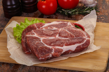 Raw pork neck steak
