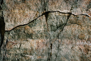 Stone texture background. The surface of granite and basalt. a large rock, a stone wall. close up....