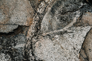 Stone texture background. The surface of granite and basalt. a large rock, a stone wall. close up....
