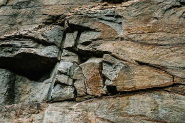 Stone texture background. The surface of granite and basalt. a large rock, a stone wall. close up. place for text.