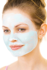 Girl with green mud mask on face