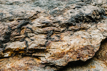 Stone texture background. The surface of granite and basalt. a large rock, a stone wall. close up....