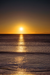 Sunset or sunrise over sea surface