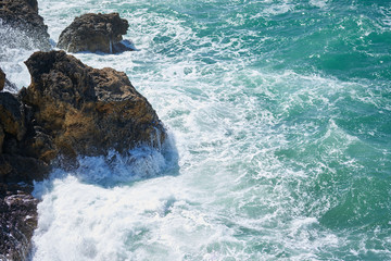 Naklejka premium Rocks and waves background