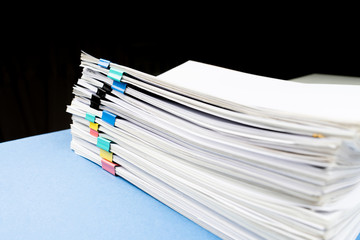 Mock up, stack of papers documents in archives files with paper clips on desk at offices, business...
