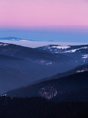 Fototapeta na wymiar Colorful winter sunset in the Carpathian mountains.Romania,Hasmas National Park.