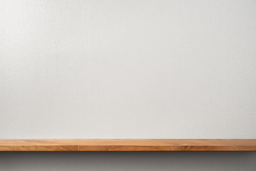 front view of black magazine stand on bookshelf