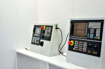 Electronic computer control panel of an industrial CNC machine tool for metalworking. Blurred focus