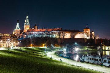 Fototapeta na wymiar Wawel Castle in Krakow seen from the Vistula boulevards. Krakow is the most famous landmark in Poland
