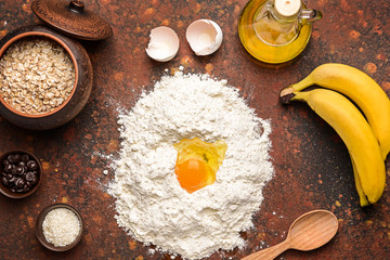 Ingredients for banana bread on color background