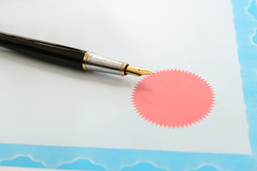 Pen of notary public on document, closeup