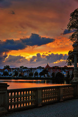 Fototapeta na wymiar Bridge railing and old town in the sunset. Mecklenburg-Vorpommern, Pomerania, Germany