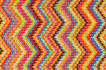 Abstract textured zigzag background of close up detail in woven raffia