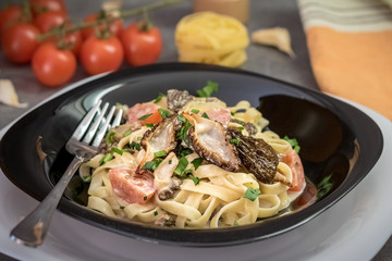 Detail shot of pasta with cream sauce from morel mushrooms