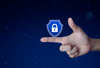 Hand pressing padlock with shield flat icon over fantasy night sky and moon, Business security...