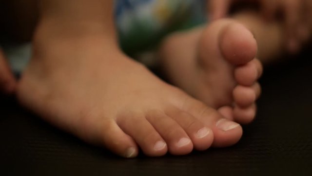 Asian baby feet on the sofa