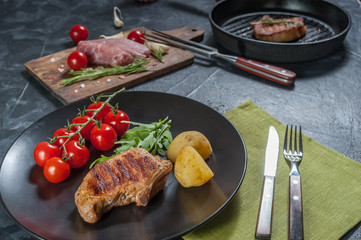 Grilled juicy pork fillet on plate