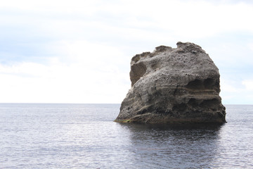 Rock like a skull. A mountain of water resembling a dead head in the sea.