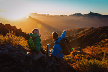 father and daughter travel in mountains, family hiking