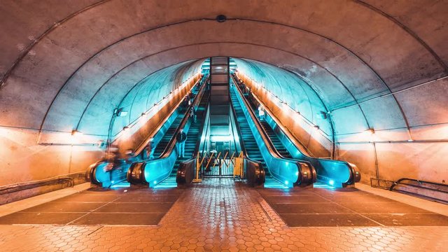 4K UHD Time-lapse of unidentified people walking and using escalator at subway station. Public transportation, or commuter lifestyle concept