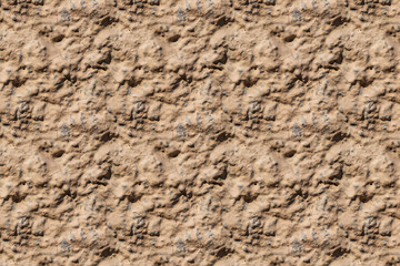 A beautiful horizontal texture of part of an old wall with yellow and orange plaster on the photo. Seamless pattern texture