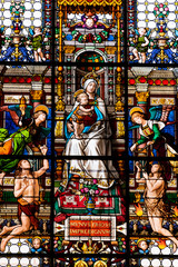 Colorful stained glass showing Mary, baby Jesus and angels