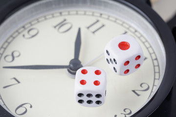 dice on an alarm clock