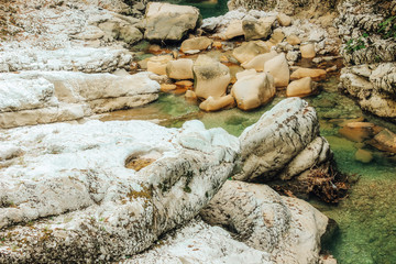 Big stones near waterfall closeup in Martvili canyon, Georgia.