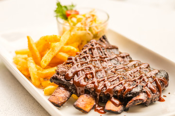 Iberico BBQ Ribs Signature melt-in-your-mouth and off-the-bone Spanish Pata Negra ribs served with cajun fries & coleslaw.