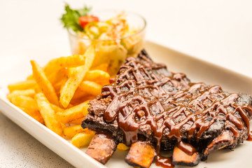 Iberico BBQ Ribs Signature melt-in-your-mouth and off-the-bone Spanish Pata Negra ribs served with cajun fries & coleslaw.