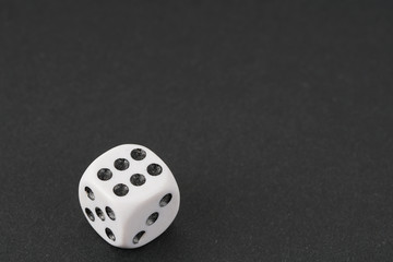 a dice over black surface