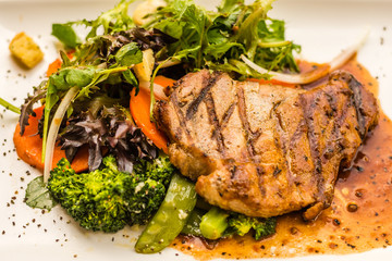 Pork Neck Fillet Steak Very tender and juicy pork collar steak served with garden veggies.  Choice of mushroom/ black pepper sauce.