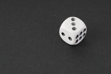 a dice over black surface